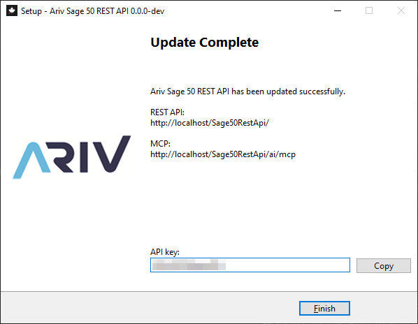 Installer completion screen showing the REST API URL, the MCP URL, and a blurred API key field with a Copy button.
